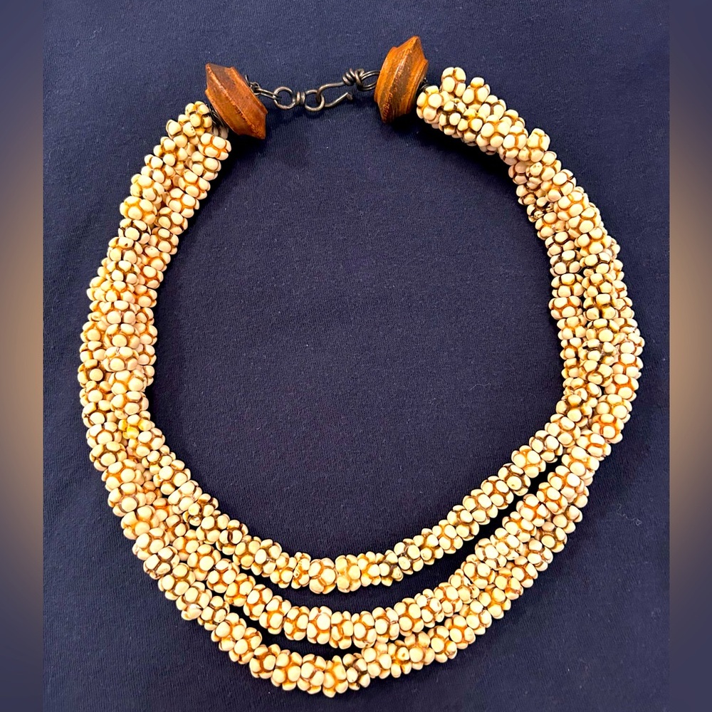 Unique triple strand shell bead necklace. Perfect for summer!